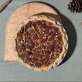 Our handcrafted Bourbon Pecan Pie combines toasted pecans, rich brown sugar, Kentucky bourbon, and pure vanilla in a buttery, flaky crust. Layers of caramelized nuts and silky filling create a warm, indulgent dessert with the perfect balance of sweetness, depth, and crunch. Serves 8–10 slices.